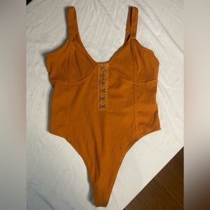 Guess burnt orange body suit. Great condition